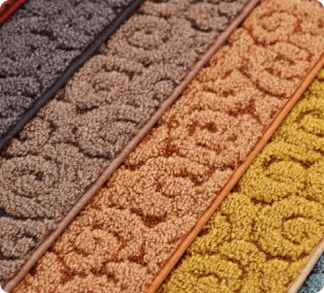 A close up of four different colored rugs